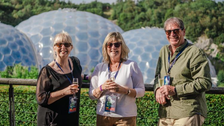 Three Sessions Plus ticket holders enjoying champagne with a view of Eden's Biomes
