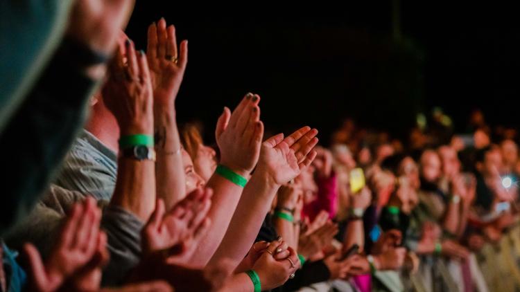 Crowd's hands clapping during an Eden Session