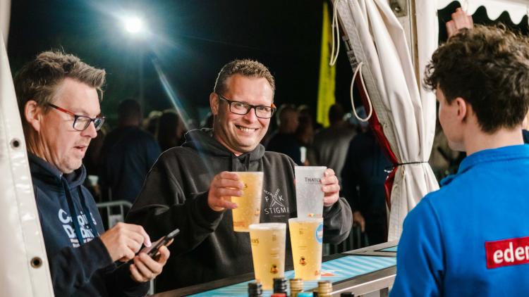 Man at a bar with two drinks