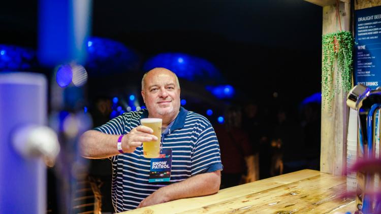 Man with beer at a bar
