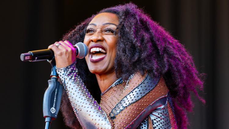 Beverley Knight singing into a microphone