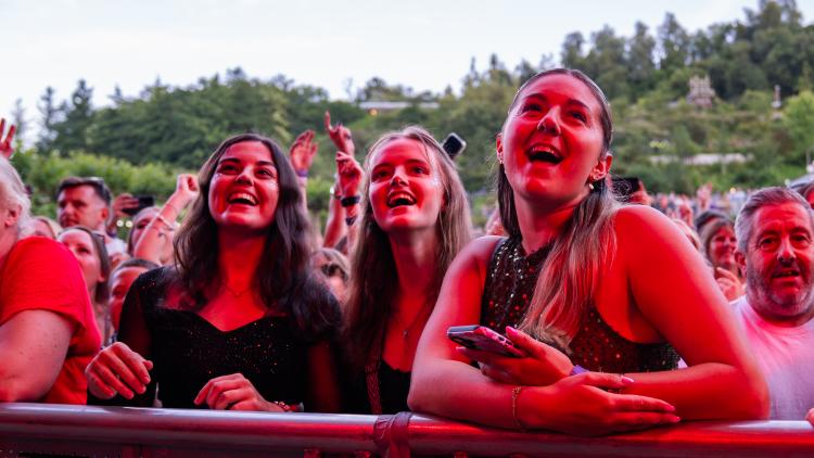 Women in crowd at an Eden Session looking happy