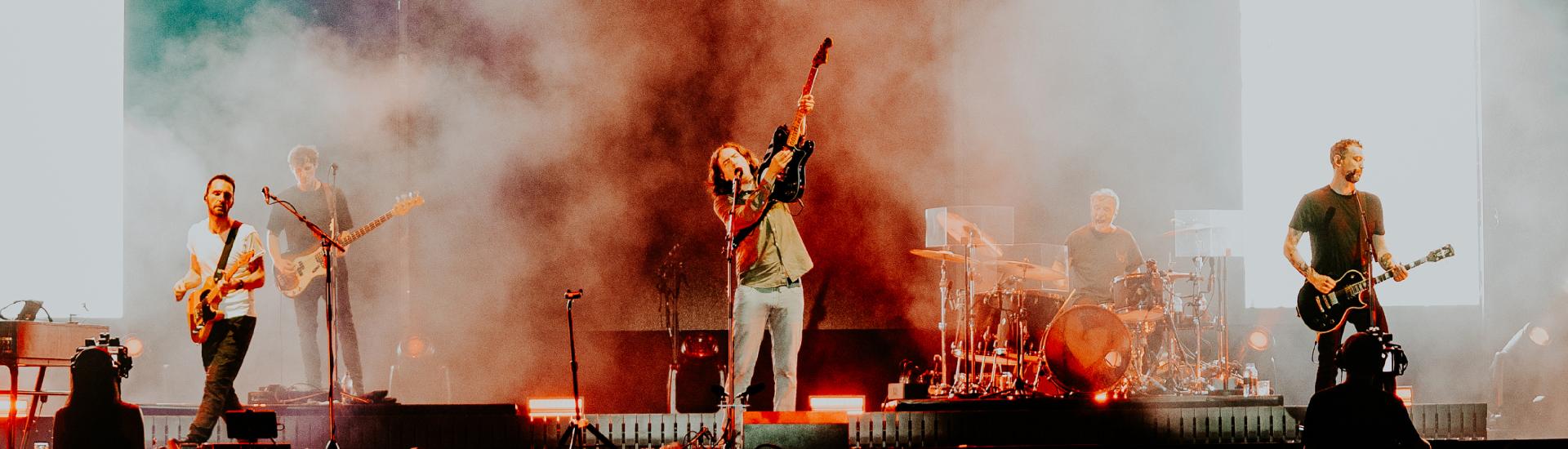 Snow Patrol band singing on stage
