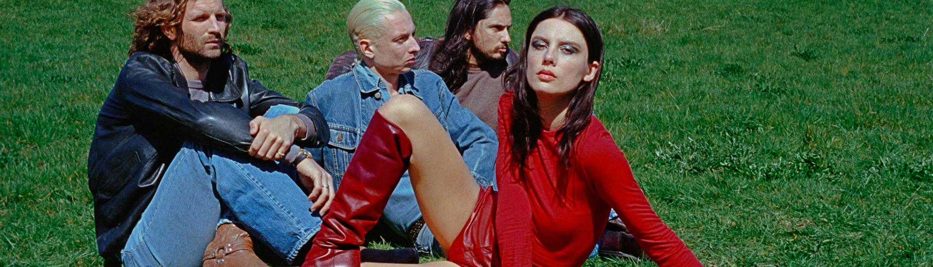 Music band Wolf Alice sat together as a group